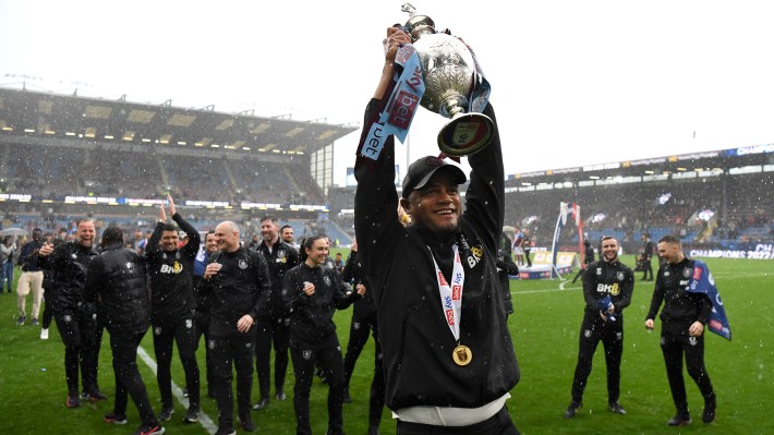 Vincent Kompany, Manager of Burnley celebrates with the Sky Bet Championship trophy celebrating promotion to the Premier League after defeating Cardiff City during the Sky Bet Championship between Burnley and Cardiff City at Turf Moor on May 08, 2023 in Burnley, England.