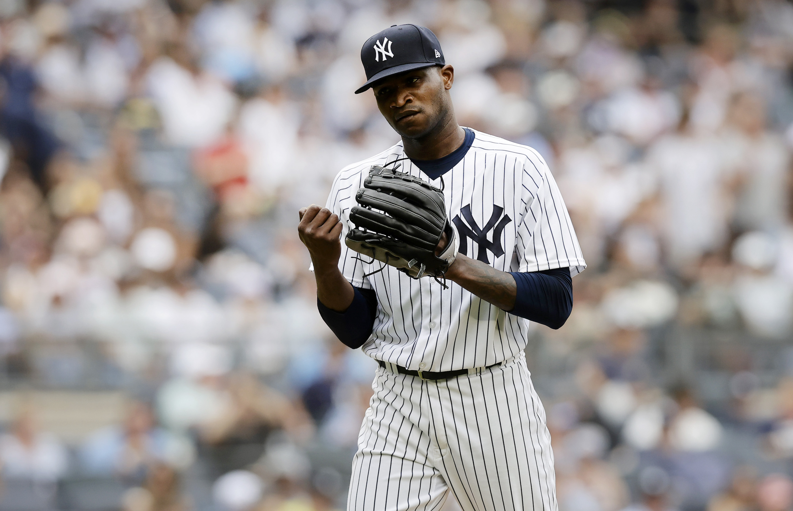 Domingo German of the New York Yankees leaves the mound during a home game against the Chicago Cubs in July of 2023.