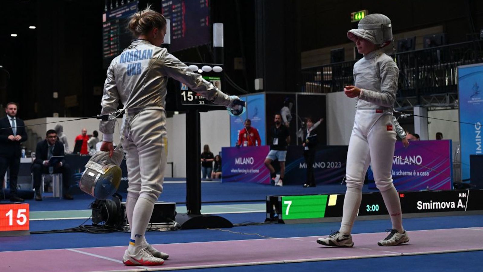 Ukraine's Olha Kharlan (L) refuses to shake hands with Russia's Anna Smirnova, registered as an Individual Neutral Athlete (AIN), after she defeated her during the Sabre Women's Senior Individual qualifiers, as part of the FIE Fencing World Championships at the Fair Allianz MI.CO (Milano Convegni) in Milan, on July 27, 2023.