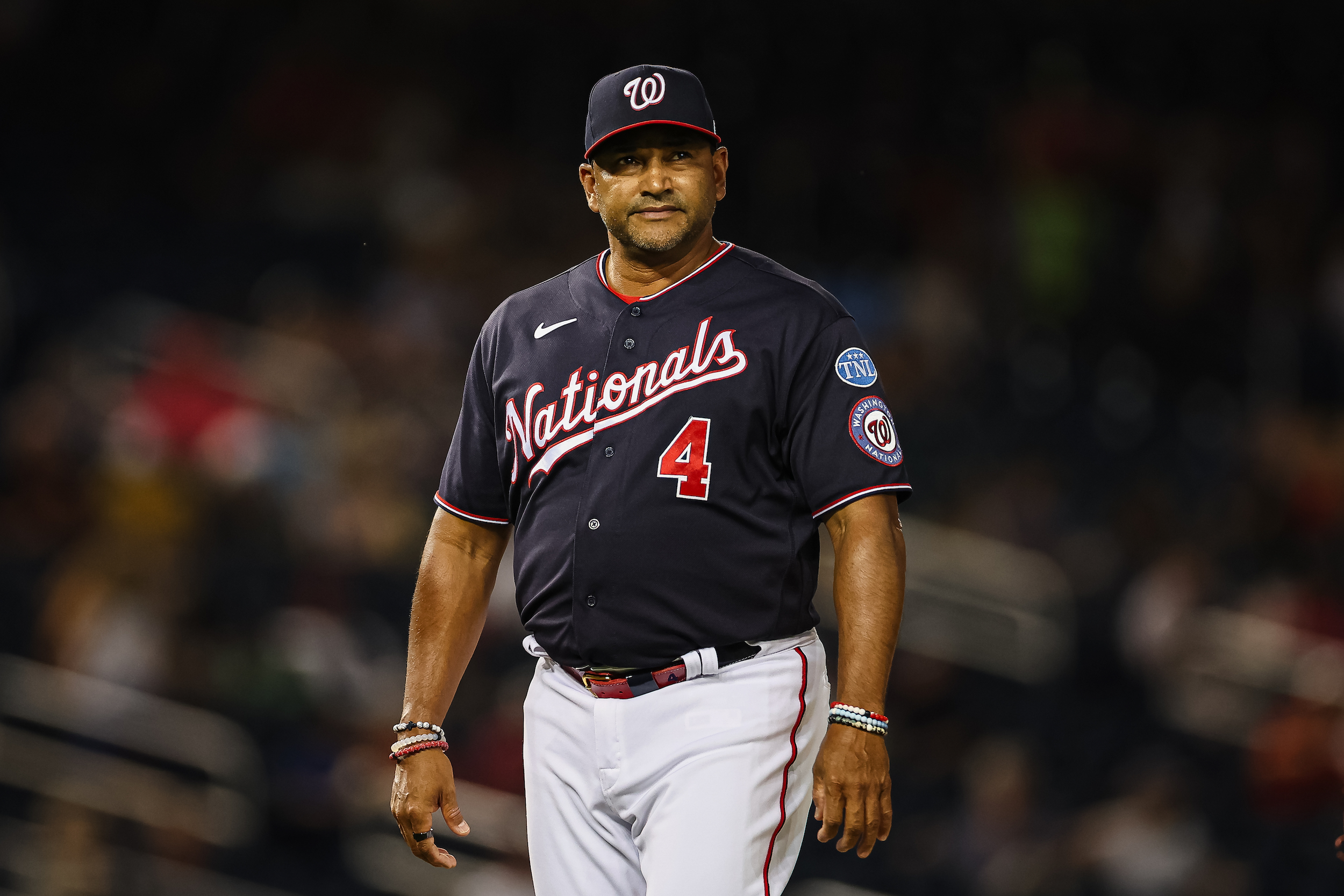 Davey Martinez emerges from the dugout during a game against the Milwaukee Brewers.