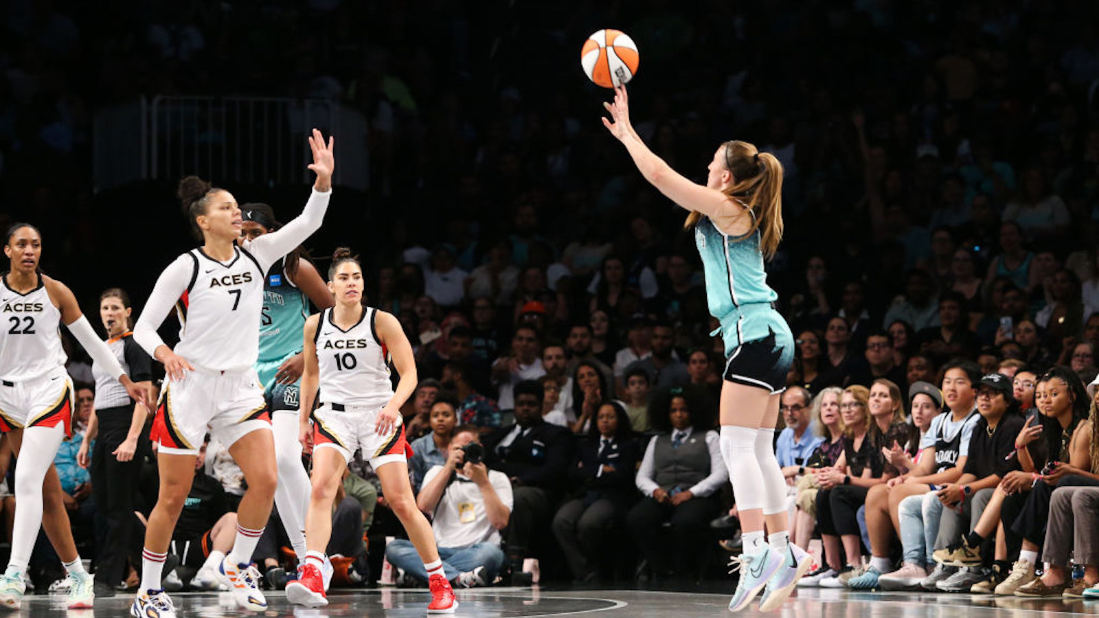 Sabrina Ionescu shoots a three-pointer