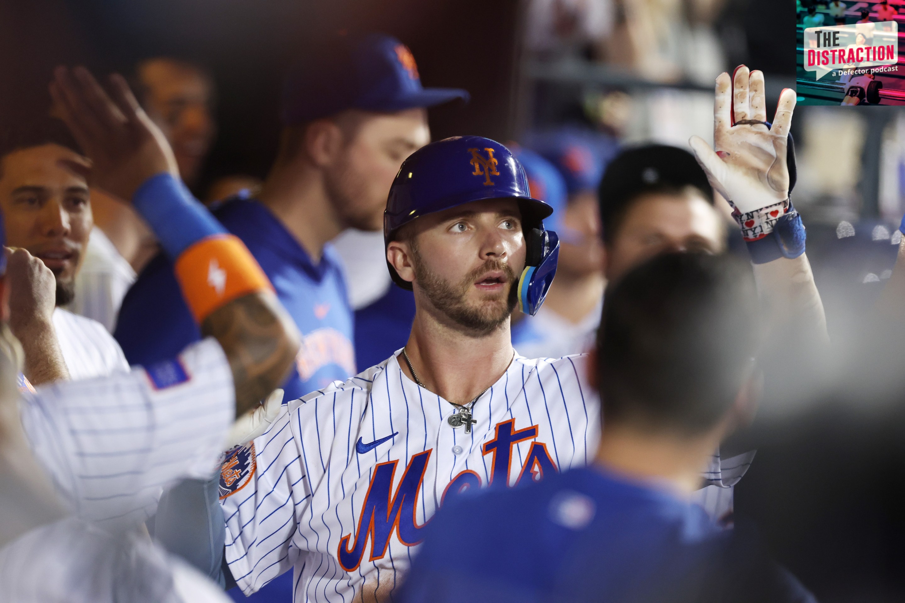 Pete Alonso high-fives his teammates in the Mets dugout after hitting a two-run homer against the Cubs on August 9, 2023.