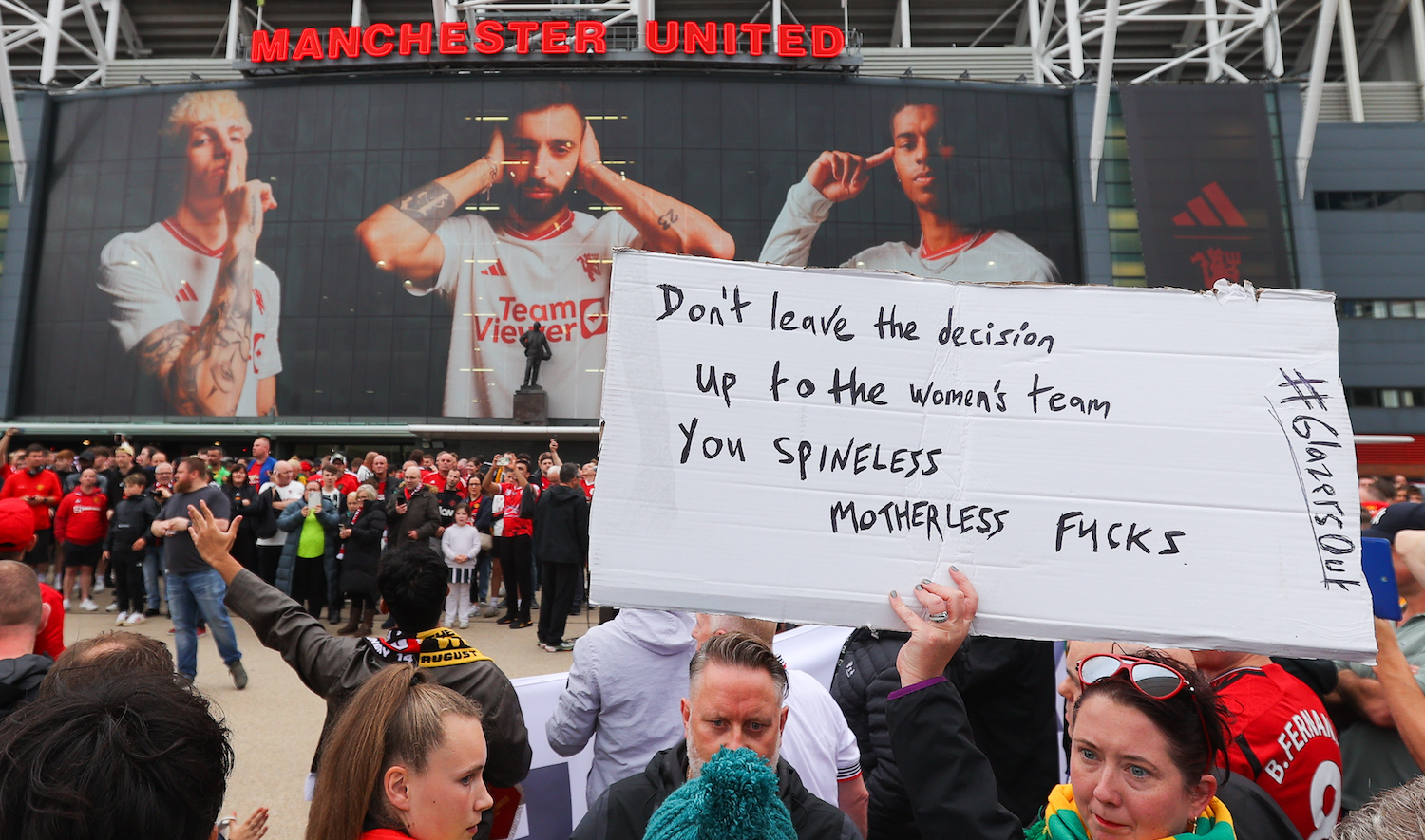MANCHESTER, ENGLAND - AUGUST 14: Manchester United supporters protest against Mason Greenwood of Manchester United and the Glazers, owners of Manchester United, outside the stadium prior to the Premier League match between Manchester United and Wolverhampton Wanderers at Old Trafford on August 14, 2023 in Manchester, England. (Photo by James Gill - Danehouse/Getty Images)