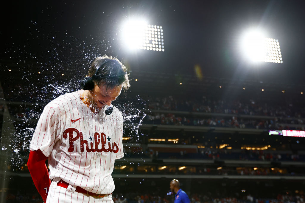 Trea Turner is sprayed with water after his walk-off