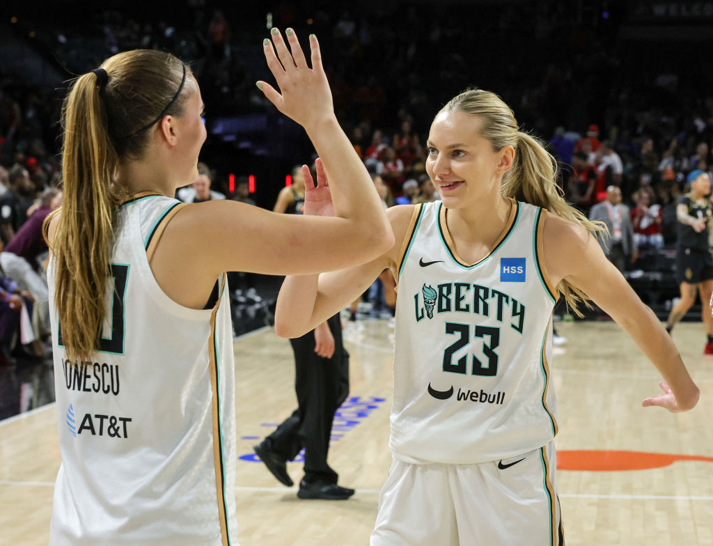 Sabrina Ionescu and Marine Johannes celebrate on the court