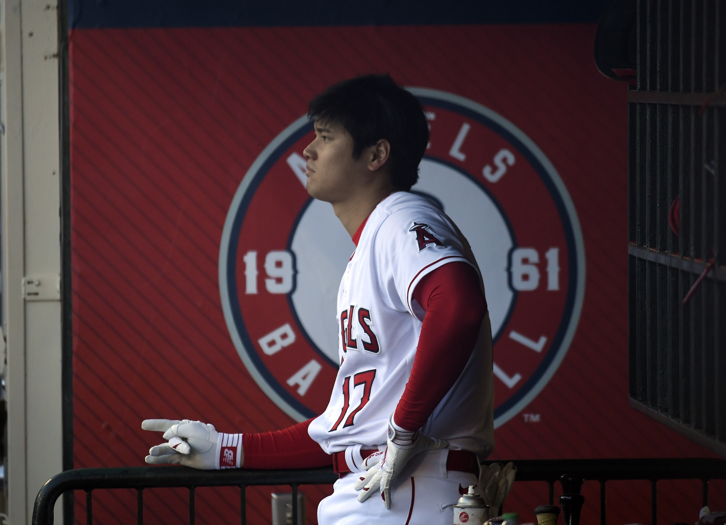 Shohei Ohtani stands in the dugout before game two of a Wednesday doubleheader.