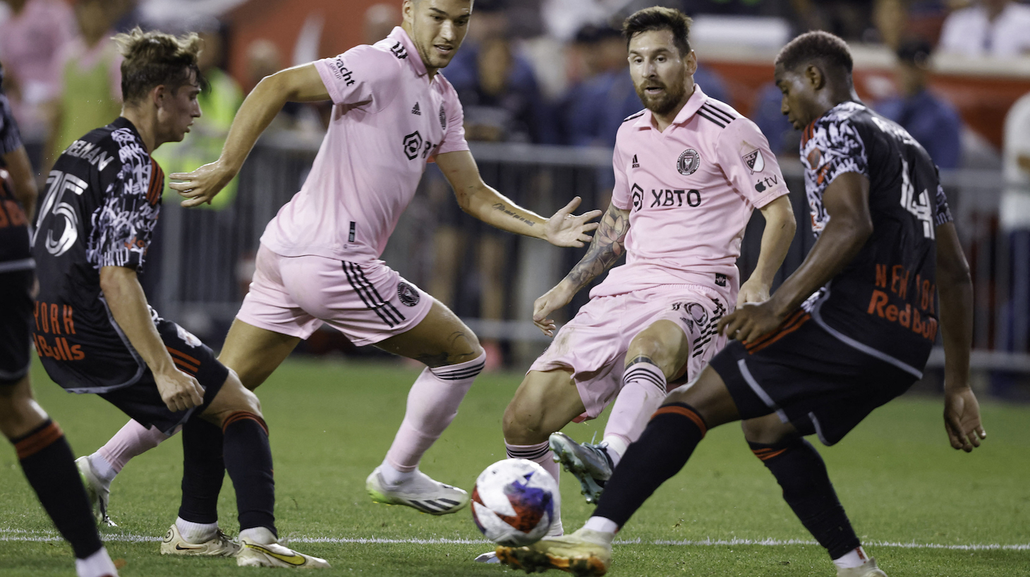 Inter Miami's Argentine forward #10 Lionel Messi and NY Red Bulls' Colombian defender #04 Andres Reyes (R) vie for the ball during the Major League Soccer 2023 match between Inter Miami and New York Red Bulls at the Red Bull arena in Harrison, New Jersey, August 26, 2023.