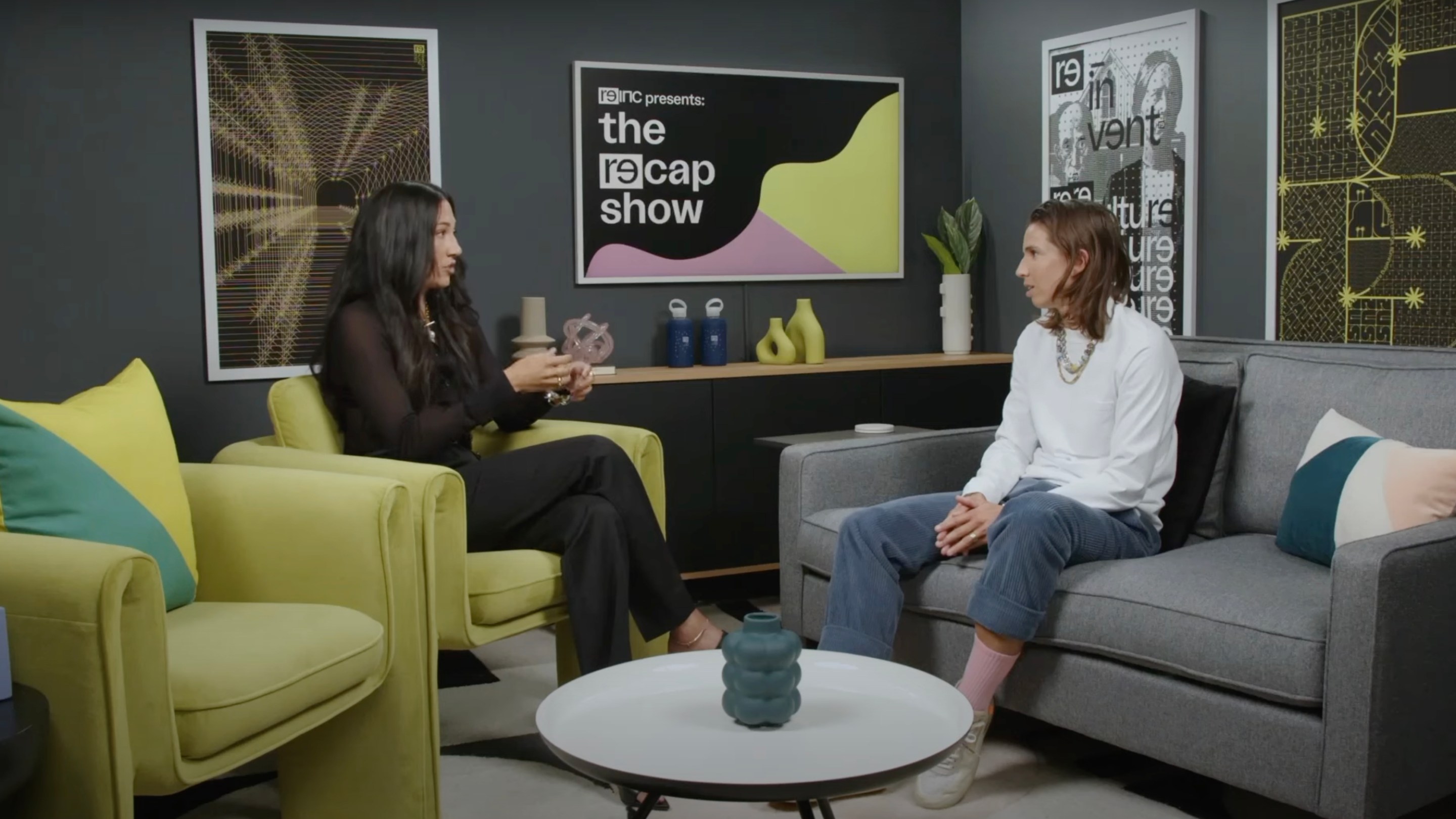 A photo of Christen Press and Tobin Heath as they sit on the set of their show, the RE-CAP show, and discuss the USWNT tie with Portugal.