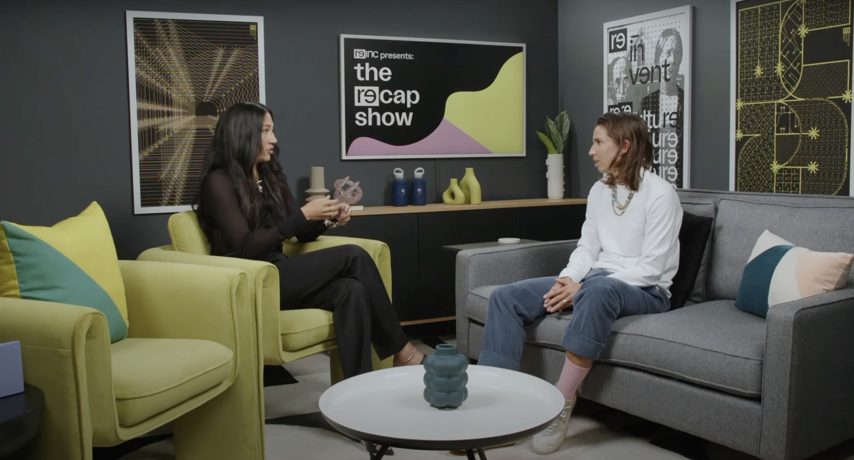 A photo of Christen Press and Tobin Heath as they sit on the set of their show, the RE-CAP show, and discuss the USWNT tie with Portugal.