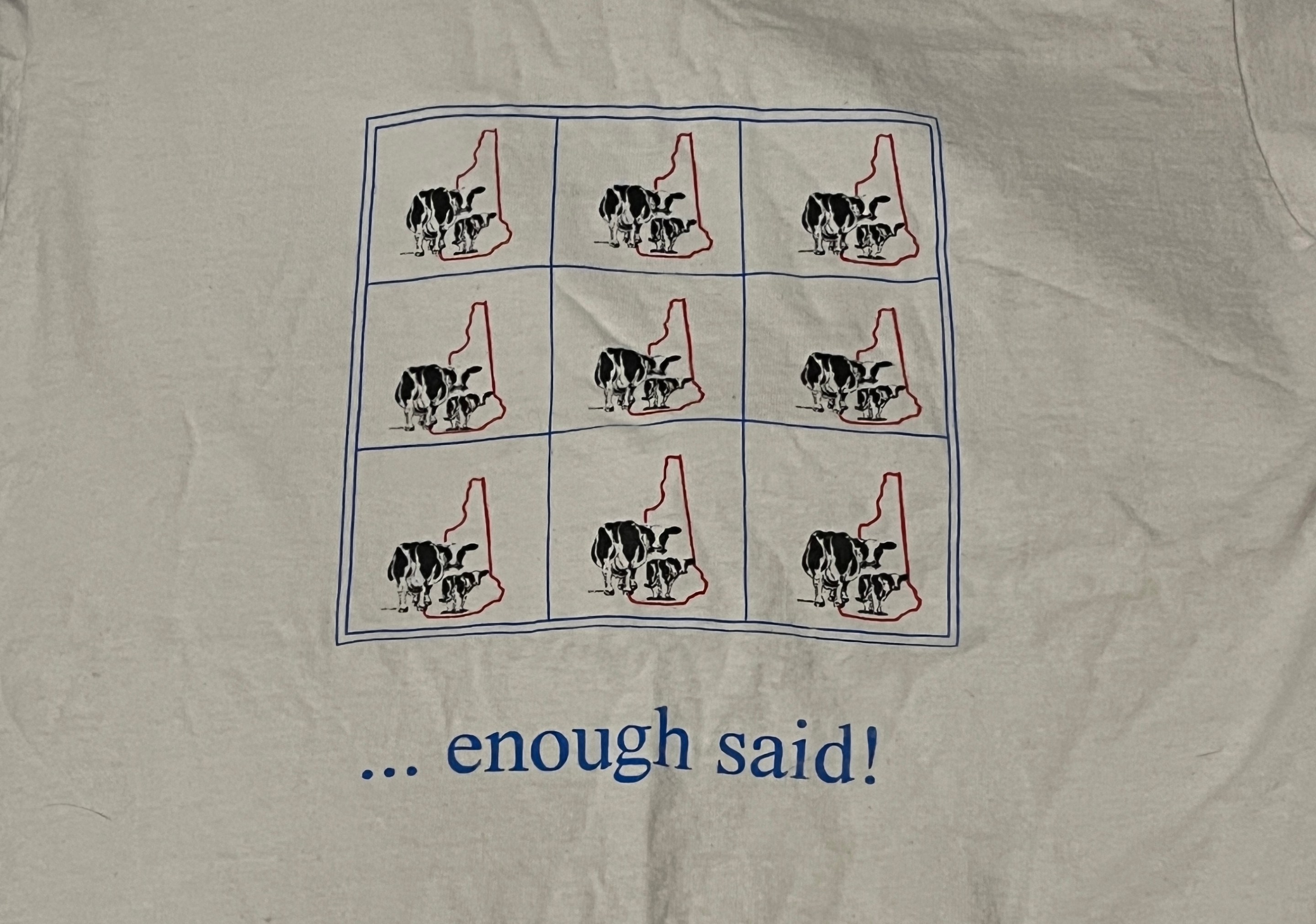 A t-shirt with a three-by-three grid. Each box has two cows standing in front of the state of New Hampshire. The bottom of the shirt says "... enough said!"