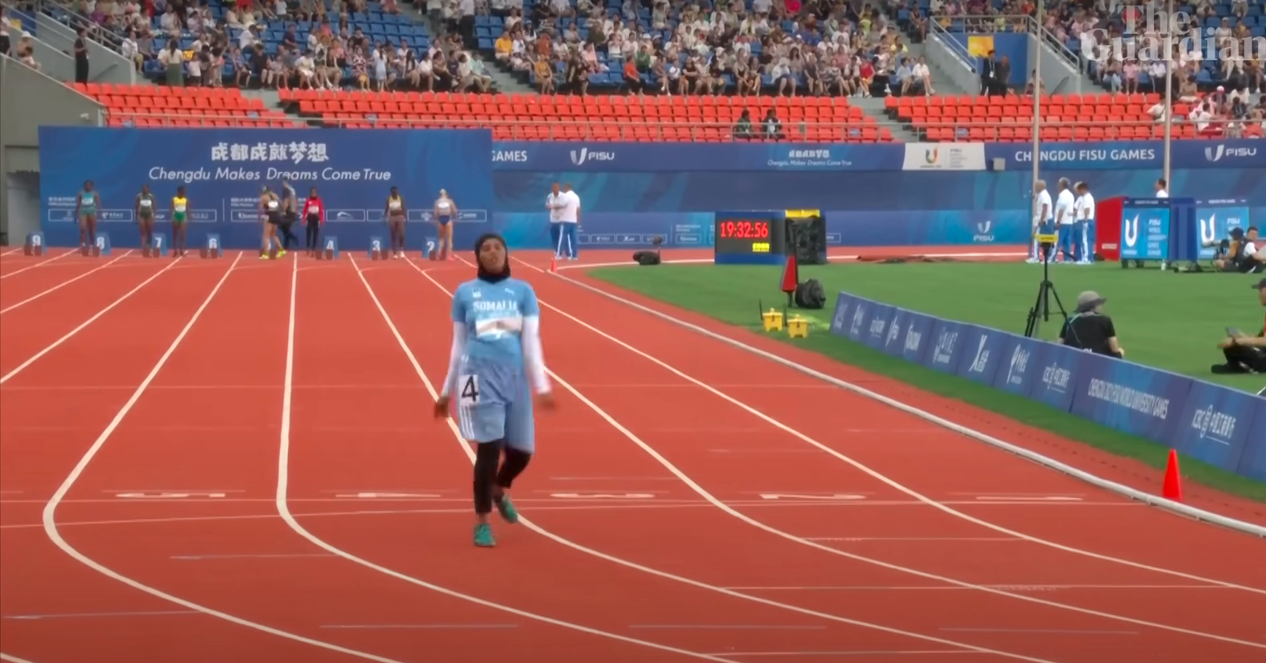 Somali sprinter Nasro Abukar Ali jogs to the finish line.