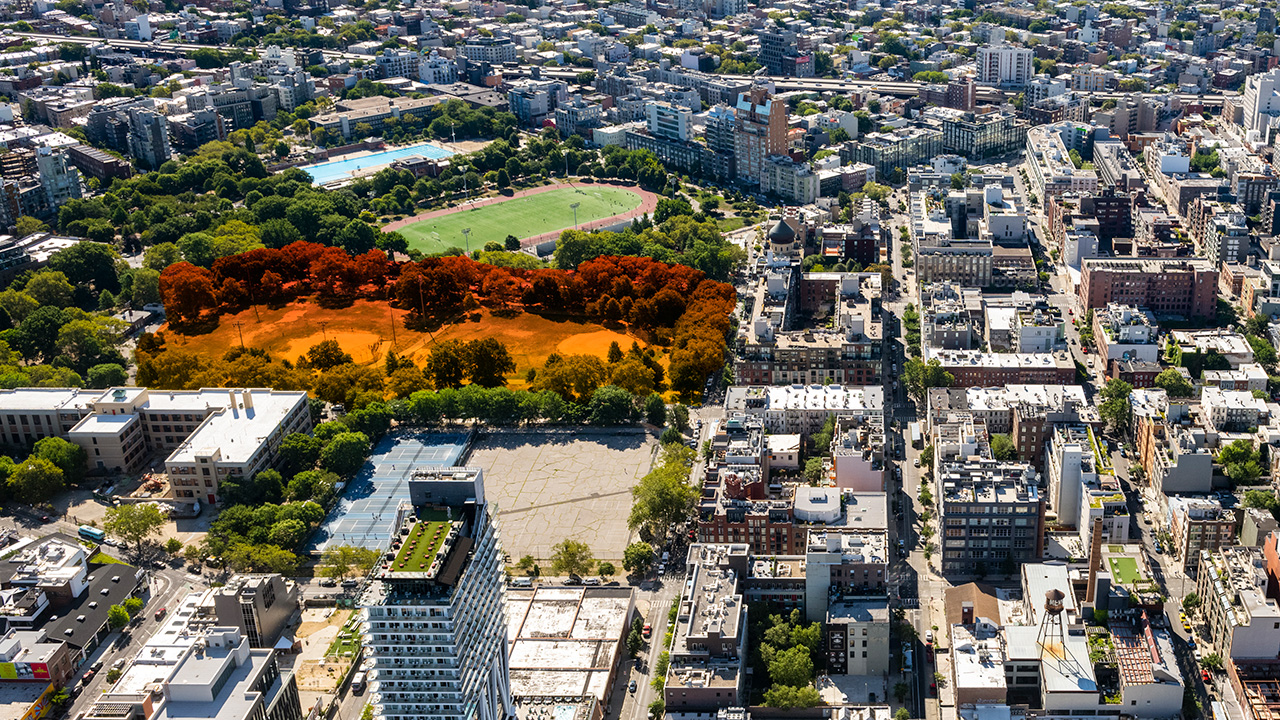 An overhead shot of the Williamsburg-Greenpoint waterfront area in Brooklyn, New York. Taken from a plane or helicopter or maybe one of those new tall buildings on the waterfront.