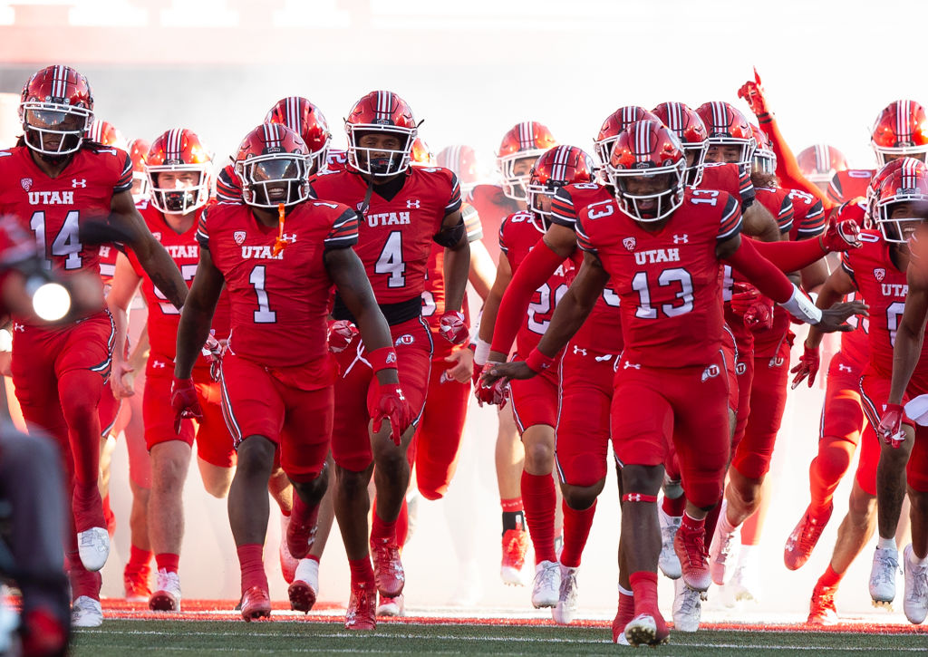 Landen King #14, Jaylon Glover #1, Munir McClain #4, Nate Johnson #13 of the Utah Utes lead the team onto the field before the start o their game agianst the Florida Gators at Rice Eccles Stadium August 31, 2023 in Salt Lake City, Utah.
