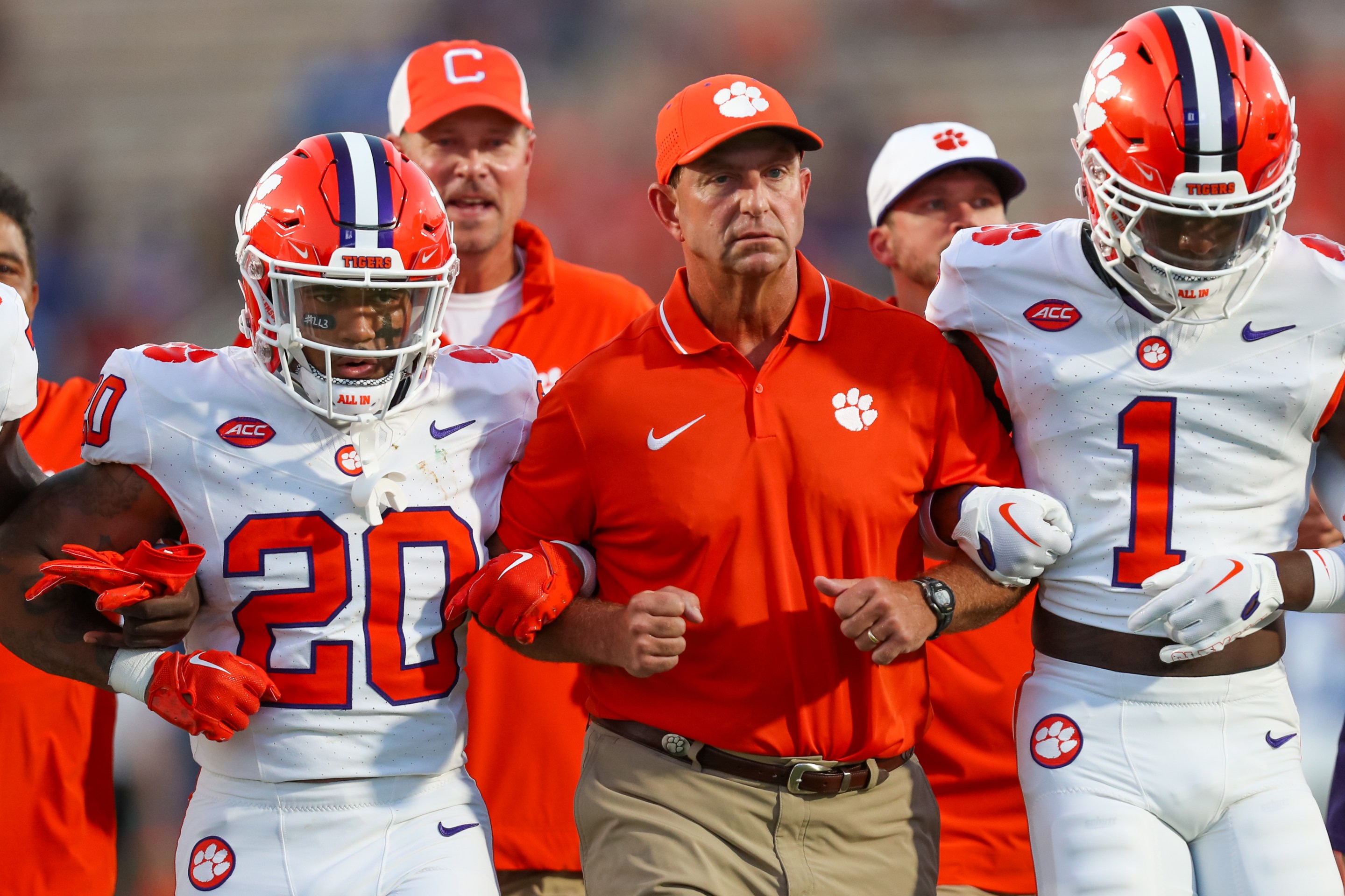 Head Coach Dabo Swinney of the Clemson Tigers walks arm in arm with his players before a football game against the Duke Blue Devils at Wallace Wade Stadium in Durham, North Carolina on Sep 4, 2023.