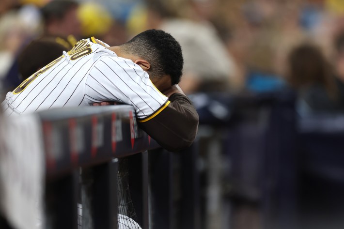 Manny Machado buries his head in his arms as the Padres stumble to another loss.