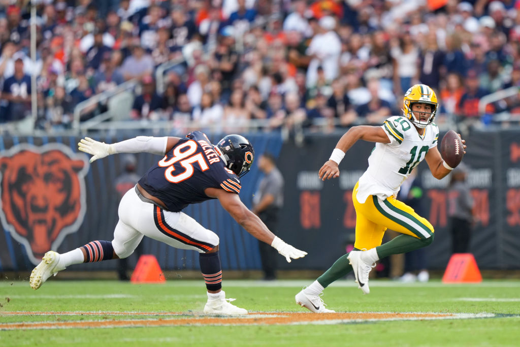 Jordan Love runs with the ball