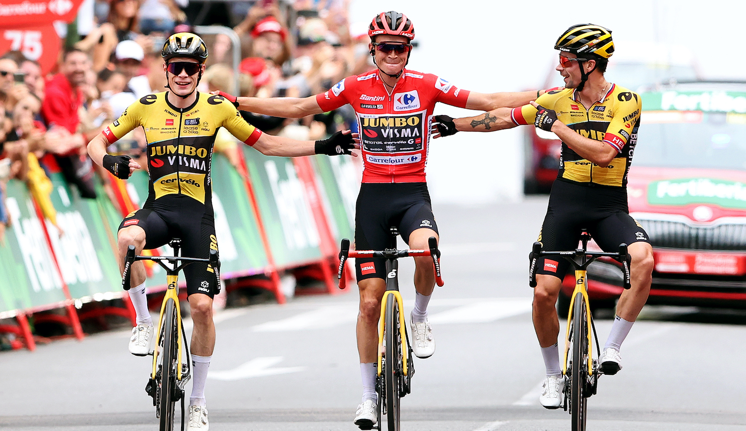 GUADARRAMA, SPAIN - SEPTEMBER 16: (EDITOR'S NOTE: Alternate crop) (L-R) Jonas Vingegaard of Denmark, Sepp Kuss of The United States - Red Leader Jersey final overall winner and Primoz Roglic of Slovenia and Team Jumbo-Visma cross the finish line during the 78th Tour of Spain 2023, Stage 20 a 207.8km stage from Manzanares El Real to Guadarrama / #UCIWT / on September 16, 2023 in Guadarrama, Spain. (Photo by Alexander Hassenstein/Getty Images)