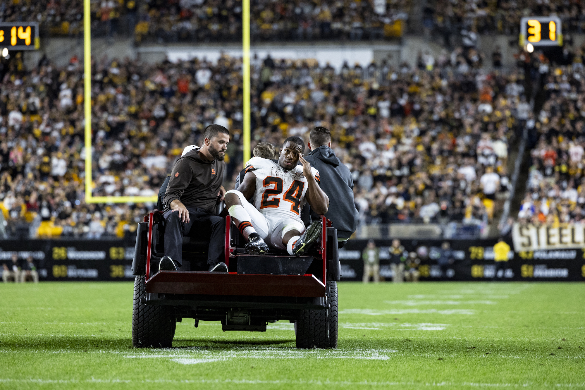 PITTSBURGH, PENNSYLVANIA - SEPTEMBER 18: Nick Chubb #24 of the Cleveland Browns is carted off of the field after hurting his knee during the second quarter of the game against the Pittsburgh Steelers at Acrisure Stadium on September 18, 2023 in Pittsburgh, Pennsylvania. (Photo by Lauren Leigh Bacho/Getty Images)
