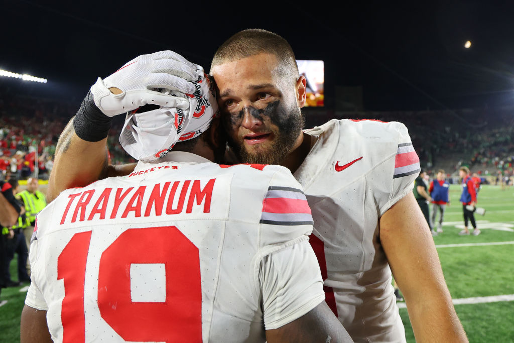 Chip Trayanum #19 and Cade Stover #8 of the Ohio State Buckeyes celebrate after defeating the Notre Dame Fighting Irish