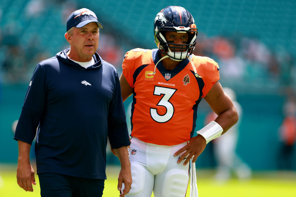 Head coach Sean Payton of the Denver Broncos talks to Russell Wilson #3 of the Denver Broncos prior to a game against the Miami Dolphins at Hard Rock Stadium on September 24, 2023 in Miami Gardens, Florida.