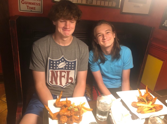 Dave McKenna's sons preparing to eat wings