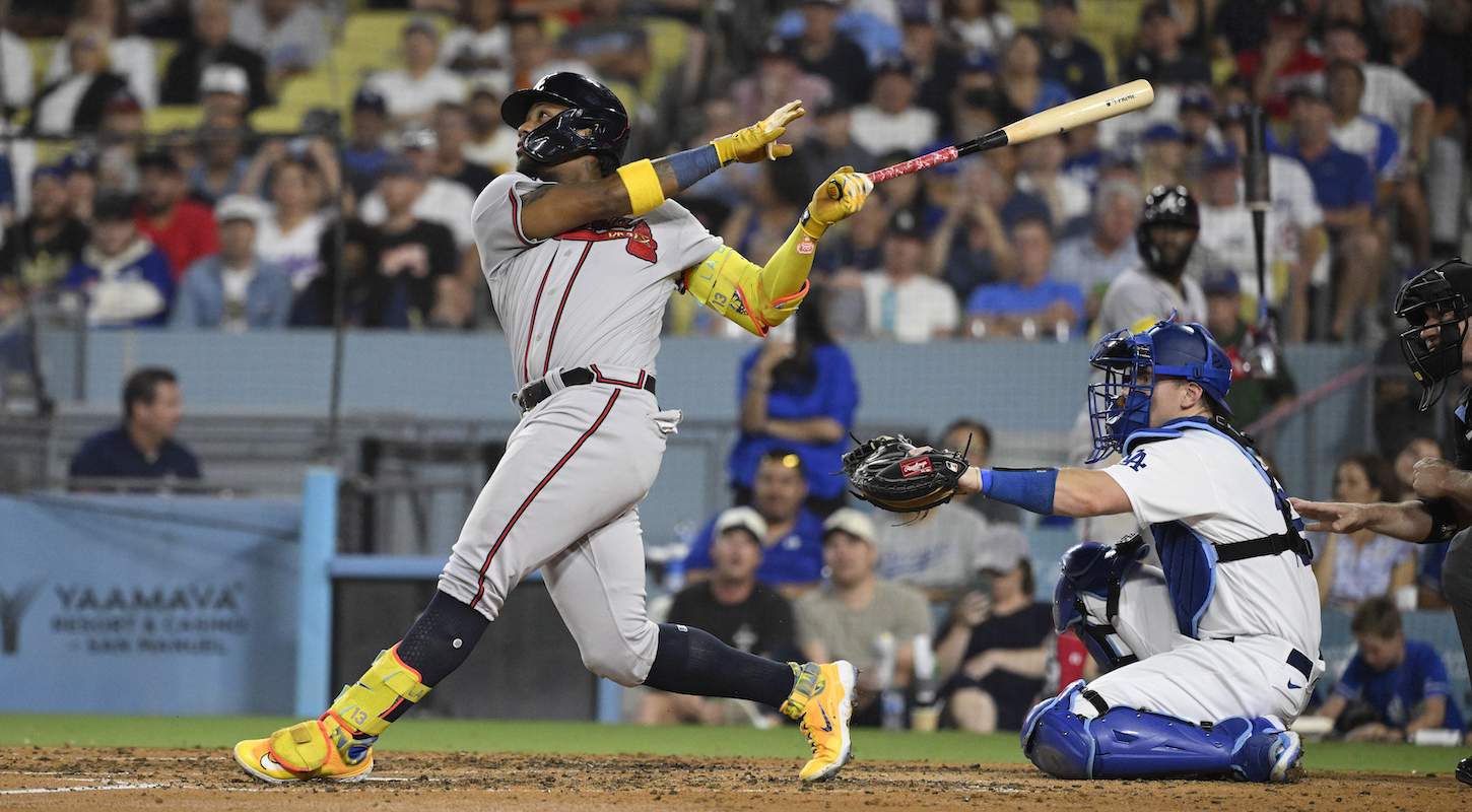 Ronald Acuña Jr. of the Atlanta Braves watches his second-inning grand slam against the Los Angeles Dodgers, which made him the first MLB player in history to hit 30 home runs and steal 60 bases in the same season.
