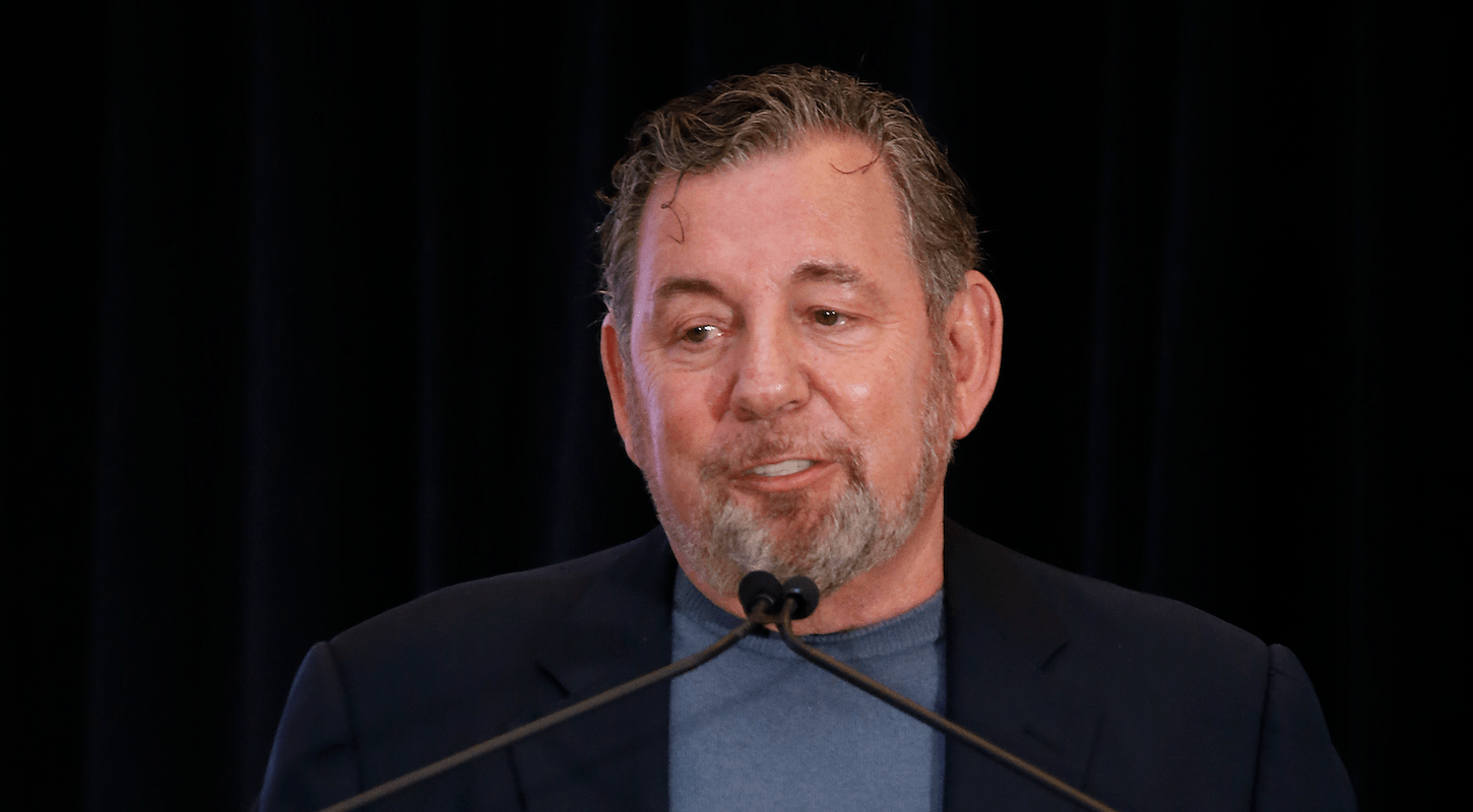 New York Knicks and Rangers owner James Dolan, looking like a big sad baby at a microphone