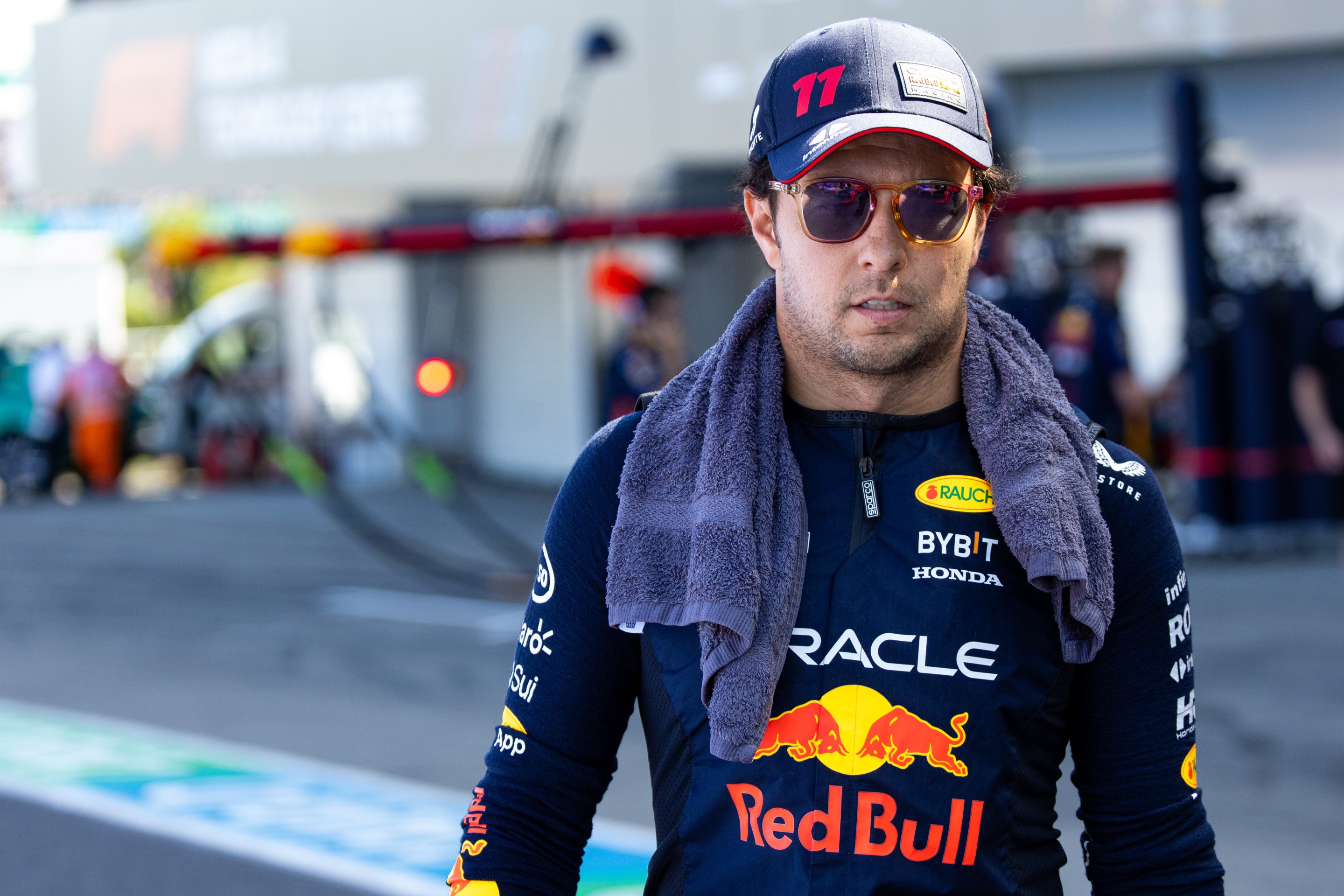 Sergio Perez arrives at the track wearing shades.