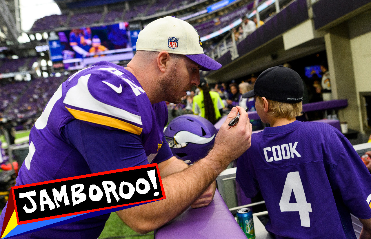 MINNEAPOLIS, MN - DECEMBER 17: Andrew DePaola #42 of the Minnesota Vikings signs a jersey for a fan before the game against the Indianapolis Colts at U.S. Bank Stadium on December 17, 2022 in Minneapolis, Minnesota. Jamboroo logo overlaid.