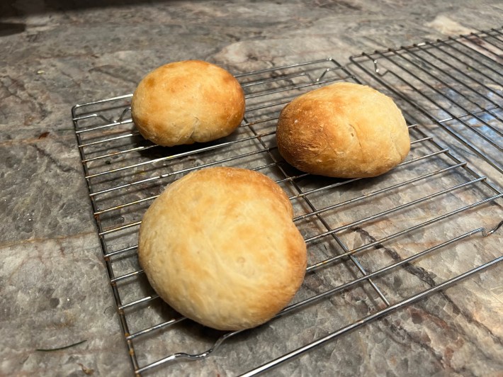 Three baked buns, unevenly browned and totally unimpressive to look at.