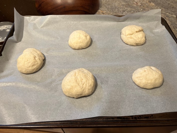 Five ugly dough balls, having grown somewhat over the course of 48 minutes in a hot bathroom.