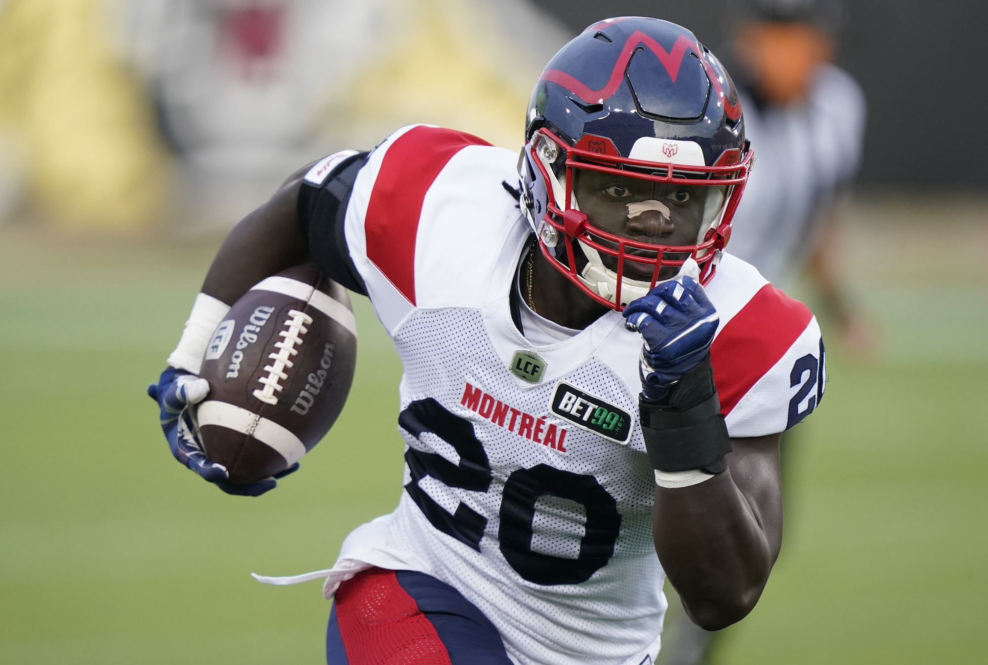 HAMILTON, ON - OCTOBER 02: Jeshrun Antwi #20 of the Montreal Alouettes gains yards after a pass reception against the Hamilton Tiger-Cats at Tim Hortons Field on October 2, 2021 in Hamilton, Canada. (Photo by John E. Sokolowski/Getty Images)