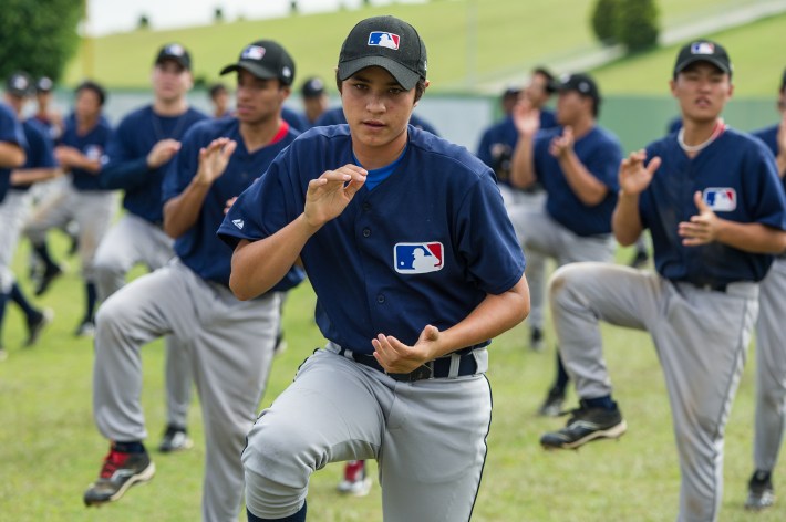 Junior players warm up at the Major Baseball League Elite Camp in Yakult training center, in Ibiuna, about 60 km west of Sao Paulo, Brazil, on February 6, 2013.