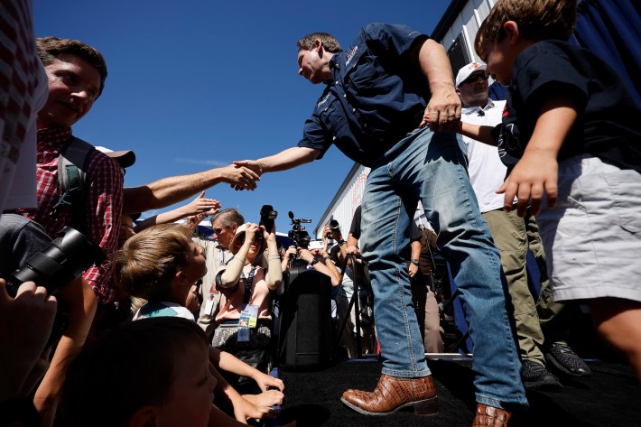 DeSantis wears brown leather boots. The toes are well curled; his toes would be at least two inches off the floor and pointing 45 degrees up from the floor.