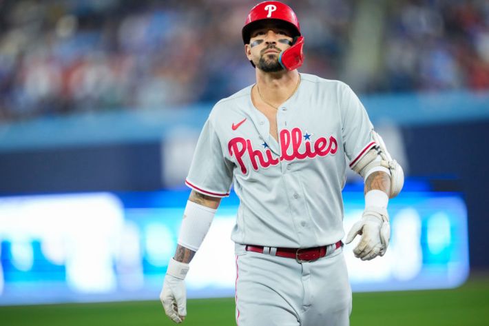 Philadelphia Phillies - Photo of Nick Castellanos and his son Liam arriving  at Citizens Bank Park. Nick is on the left wearing a tan colored hoodie  with a white shirt underneath. He