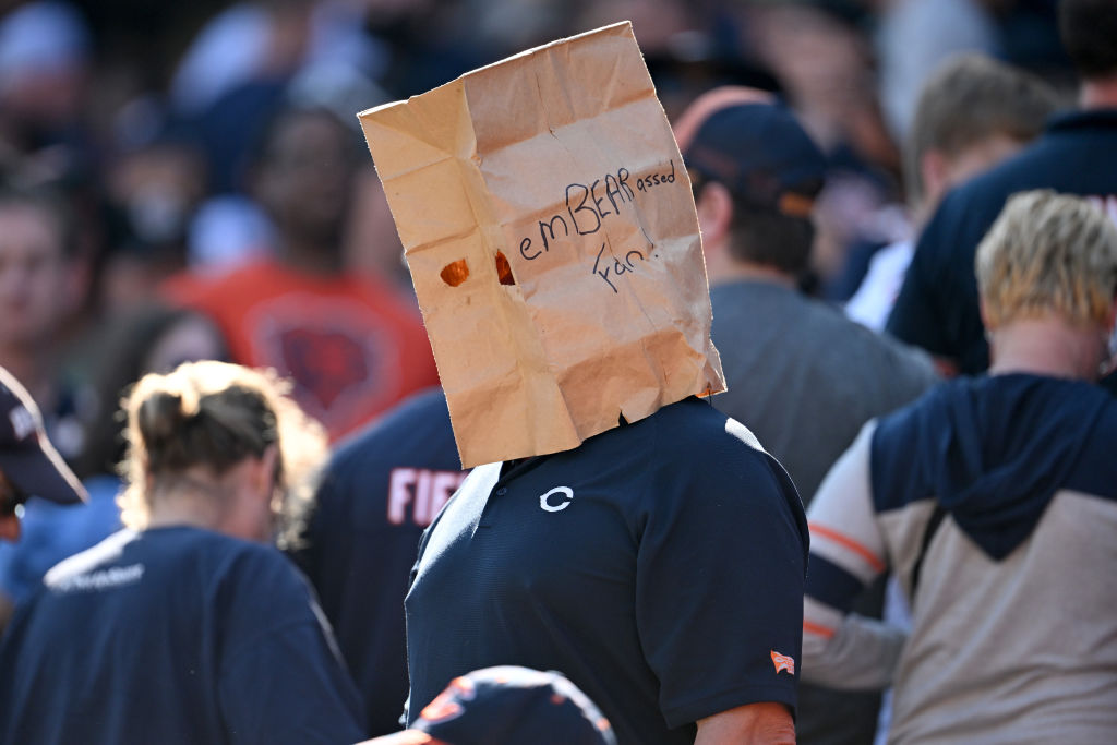 A Chicago Bears bears fan stands with a paper bag on his head after the game against the Denver Broncos at Soldier Field on October 01, 2023 in Chicago, Illinois.
