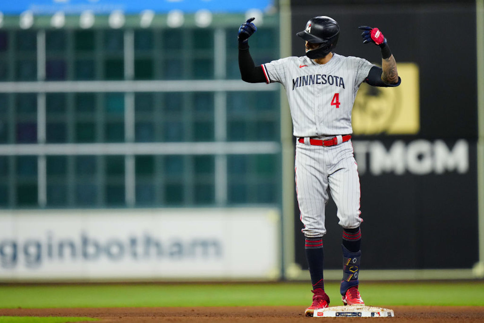 Carlos Correa #4 of the Minnesota Twins reacts after hitting a double in the seventh inning during Game 2 of the Division Series between the Minnesota Twins and the Houston Astros at Minute Maid Park on Sunday, October 8, 2023 in Houston, Texas.