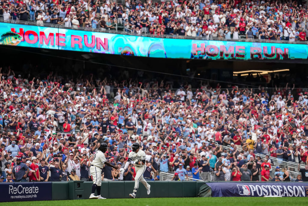 Royce Lewis celebrates after hitting a home run