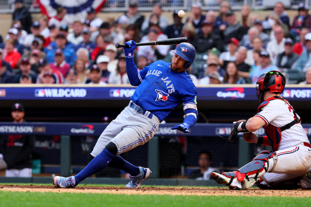 George Springer dodges a wild pitch