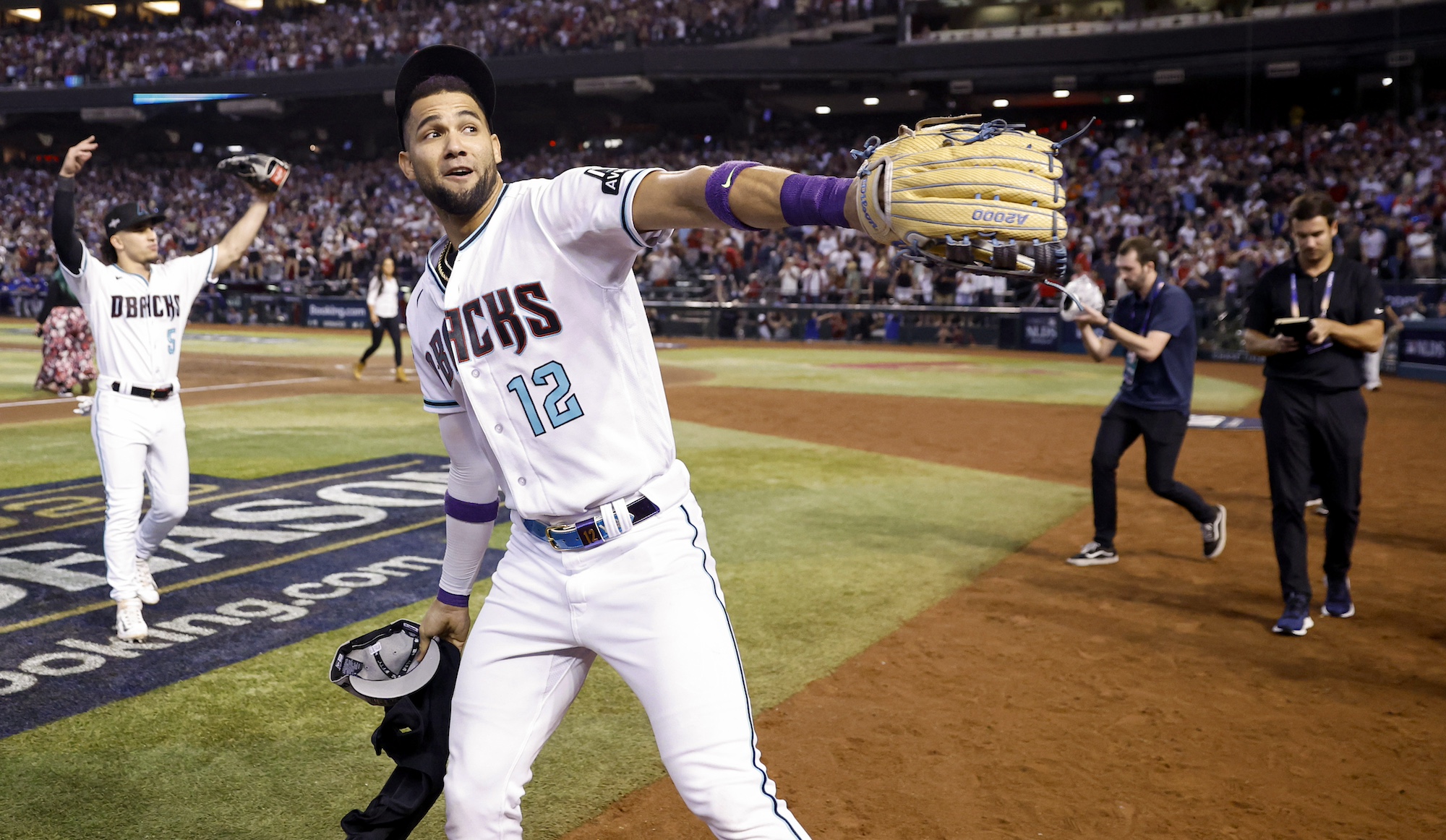 PHOENIX, AZ - OCTOBER 11: Lourdes Gurriel Jr. #12 of the Arizona Diamondbacks celebrates after winning against the Los Angeles Dodgers during Game 3 of the Division Series at Chase Field on Wednesday, October 11, 2023 in Phoenix, Arizona. The Arizona Diamondbacks won 4-2. (Photo by Chris Coduto/MLB Photos via Getty Images)