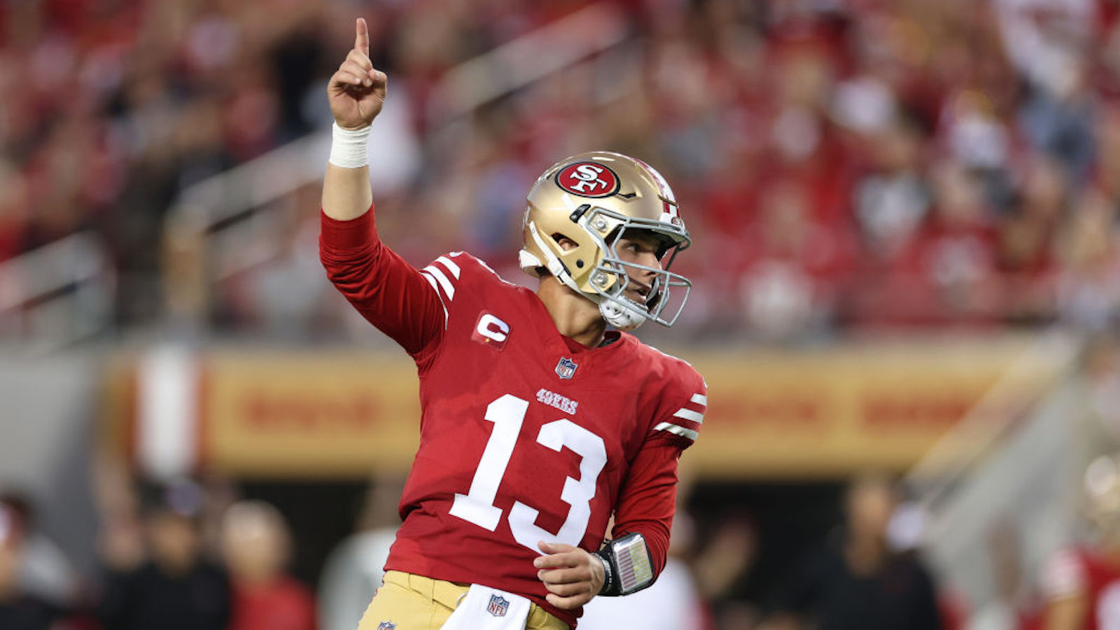 Brock Purdy #13 of the San Francisco 49ers reacts after a touchdown by Christian McCaffrey #23 during the second quarter against the Dallas Cowboys at Levi's Stadium on October 08, 2023 in Santa Clara, California.