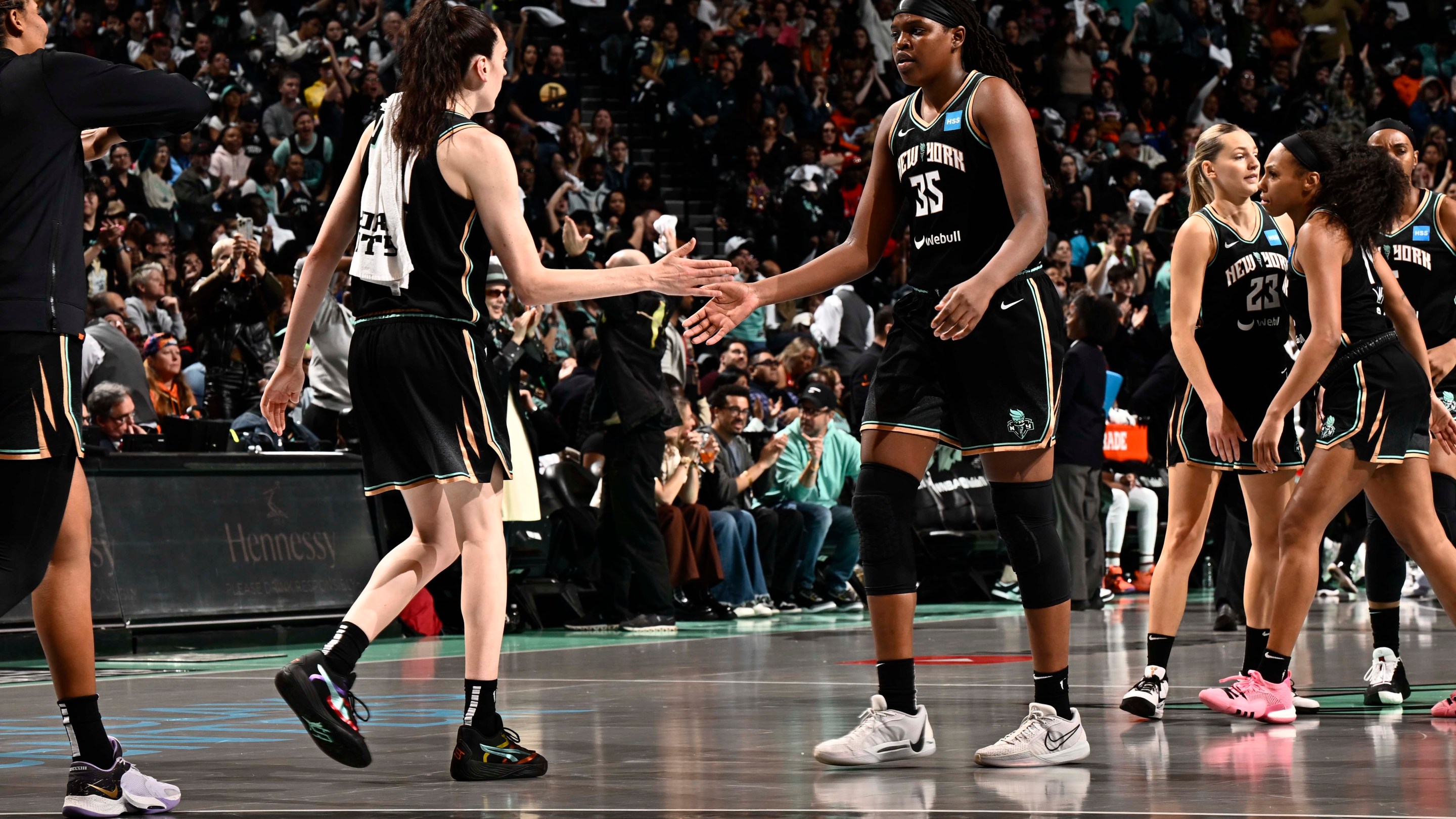 Jonquel Jones #35 of the New York Liberty and Breanna Stewart #30 high five during the game against the Las Vegas Aces during game 3 of the 2023 WNBA Finals on October 15, 2023 at the Barclays Center in Brooklyn, New York.