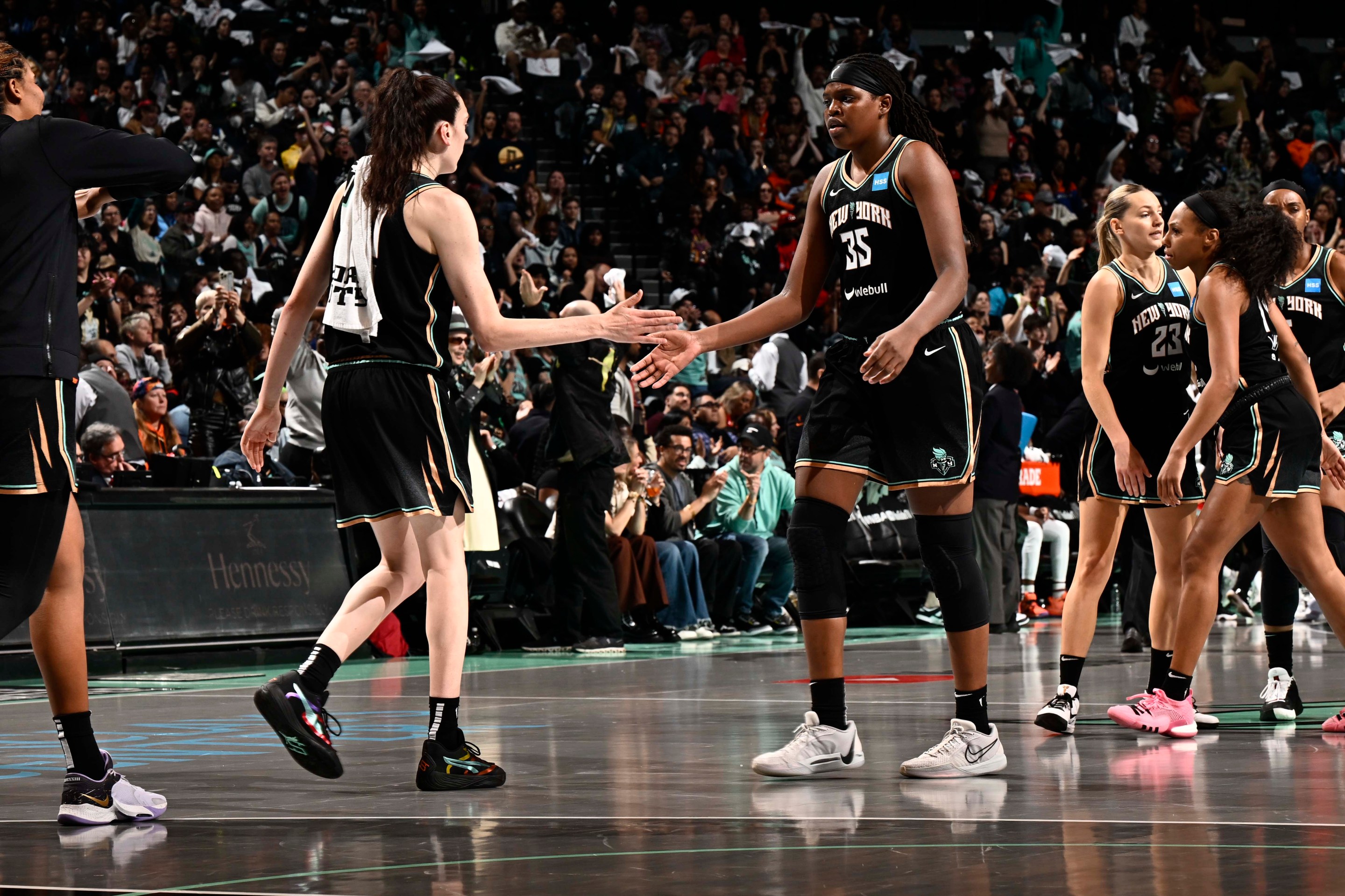 Jonquel Jones #35 of the New York Liberty and Breanna Stewart #30 high five during the game against the Las Vegas Aces during game 3 of the 2023 WNBA Finals on October 15, 2023 at the Barclays Center in Brooklyn, New York.