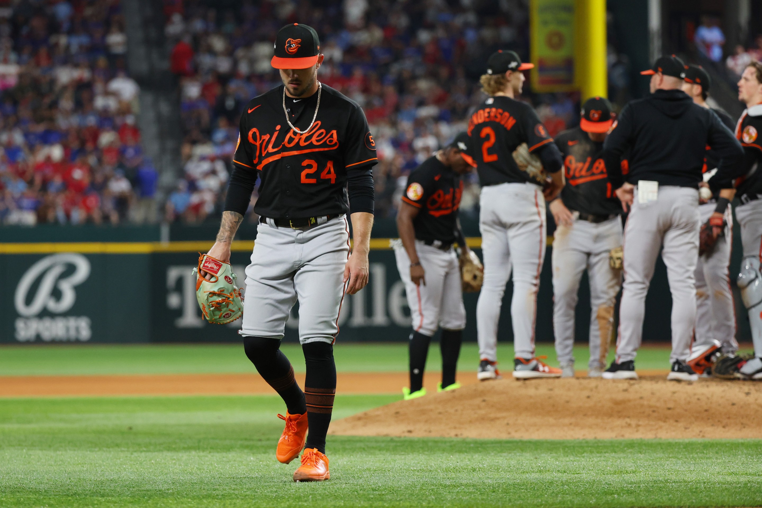 Orioles reliever DL Hall leaves the mound while his teammates wait for the reliever who will relieve him during the team's Game 3 loss in the American League Divisional Series.