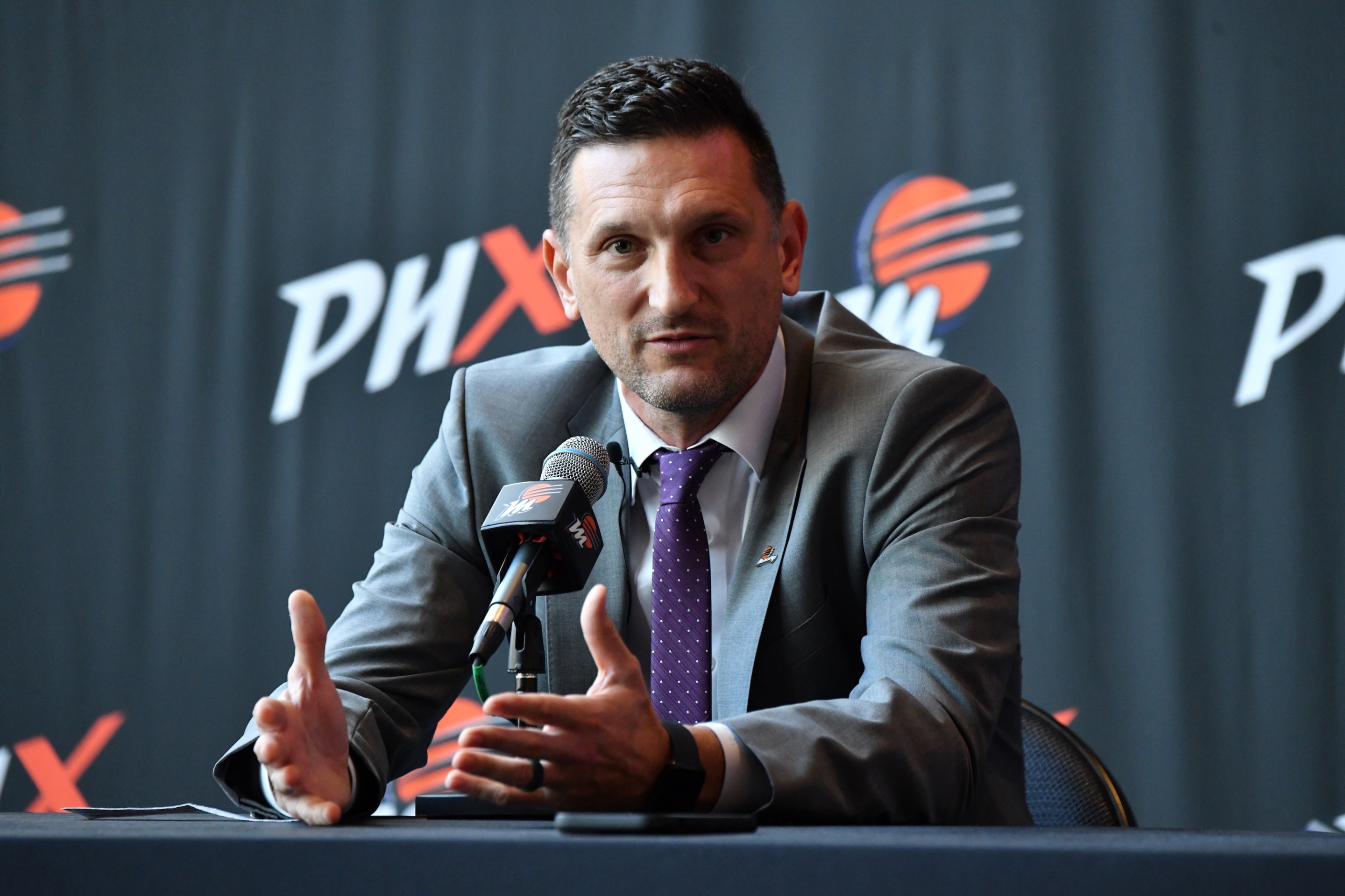 Nate Tibbetts talks to the media during a press conference announcing him as the team's new head coach on October 20, 2023, at the Footprint Center in Phoenix, Arizona.