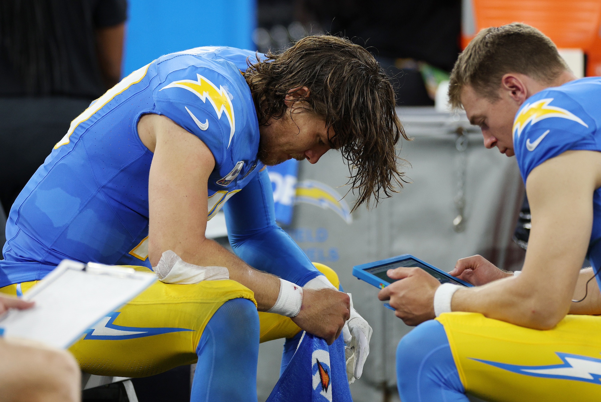 INGLEWOOD, CALIFORNIA - OCTOBER 16: Justin Herbert #10 of the Los Angeles Chargers reacts on the bench in the second half against the Dallas Cowboys at SoFi Stadium on October 16, 2023 in Inglewood, California. (Photo by Kevork Djansezian/Getty Images)