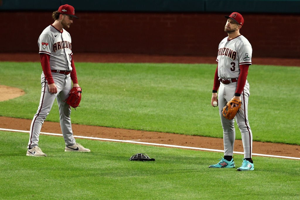 Evan Longoria and Ryne Nelson look disappointed about the ball that dropped