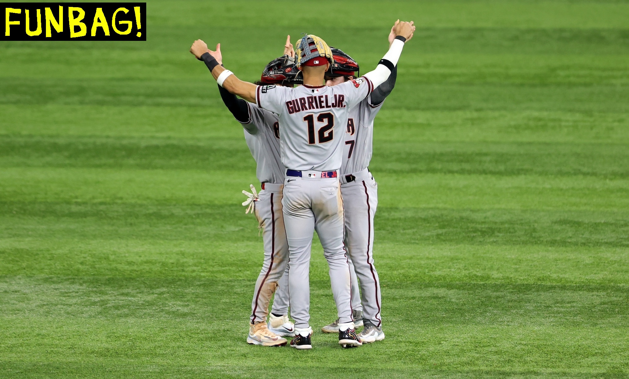 ARLINGTON, TX - OCTOBER 28: Alek Thomas #5, Corbin Carroll #7 and Lourdes Gurriel Jr. #12 of the Arizona Diamondbacks celebrate after the Diamondbacks defeated the Texas Rangers in Game 2 of the 2023 World Series between the Arizona Diamondbacks and the Texas Rangers at Globe Life Field on Saturday, October 28, 2023 in Arlington, Texas. (Photo by Rob Tringali/MLB Photos via Getty Images)