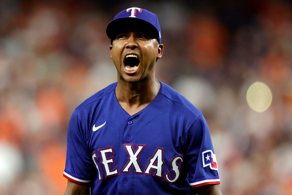 Jose Leclerc #25 of the Texas Rangers celebrates after striking out Jon Singleton #28 of the Houston Astros to end the eighth inning in Game Six of the American League Championship Series at Minute Maid Park on October 22, 2023 in Houston, Texas.