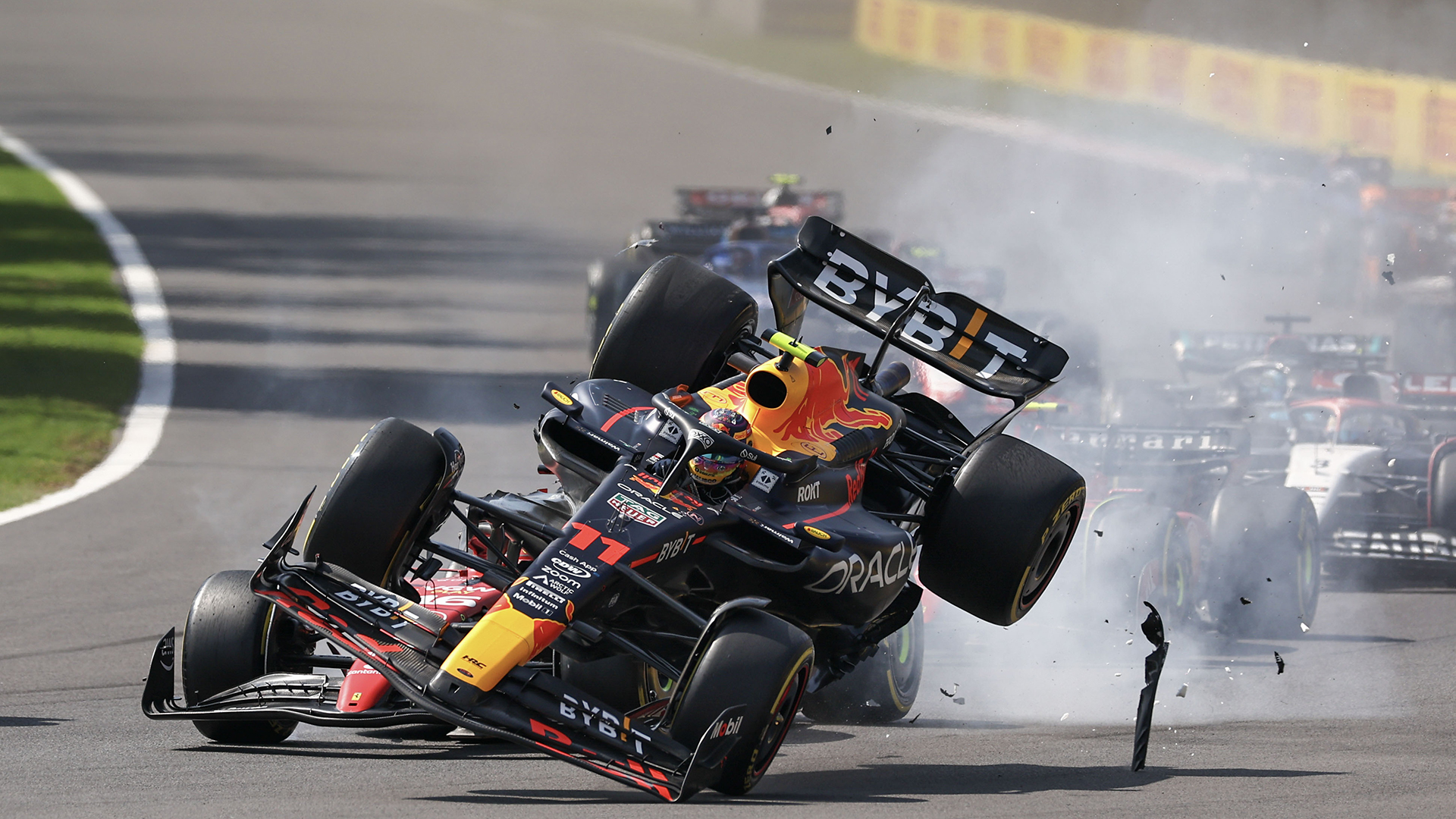 Sergio Perez of Mexico driving the (11) Oracle Red Bull Racing RB19 collides with Charles Leclerc of Monaco driving the (16) Ferrari SF-23 during the F1 Grand Prix of Mexico at Autodromo Hermanos Rodriguez on October 29, 2023 in Mexico City, Mexico.